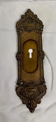"Antigua cubierta de placa de escudo de cerradura de puerta de 1900 ornamentada 10"" latón largo francés" Foto 1 de 4