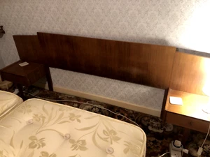 A Younger Ltd. Teak double headboard with side tables and drawers. - Picture 1 of 5
