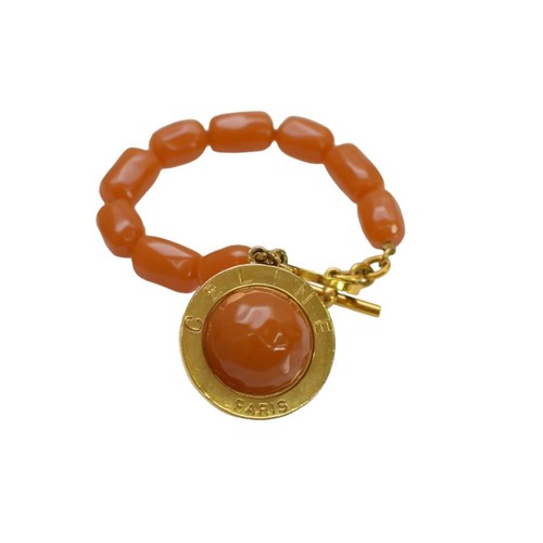 Accessorio bracciale Celine pietre marroni e tono oro con ciondolo logo