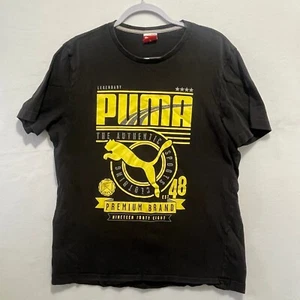 Camiseta negra Puma Premium Brand logotipo amarillo para hombre M - Imagen 1 de 6