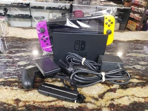 NINTENDO SWITCH WITH NEON PURPLE AND NEON ORANGE JOY-CON & 128 MICRO MEMORY CARD - Bild 1 von 8