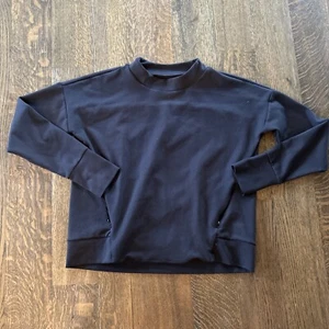 Pullover Athleta Denali cuello falso talla mediana negro bolsillos con cremallera - Imagen 1 de 10