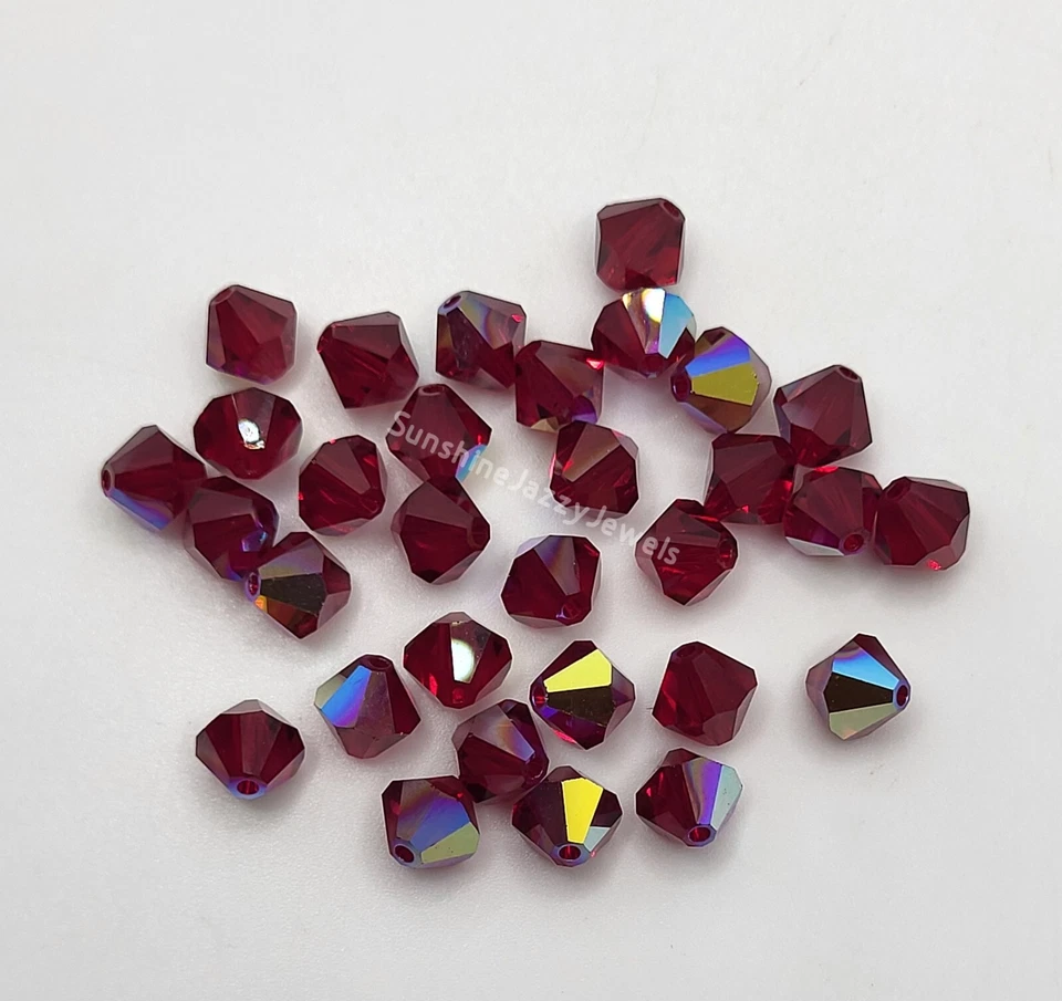 Swarovski Crystal Siam AB Bicone Beads; Red; 4mm (24pc) or 6mm (12pc) - Image 1 of 1