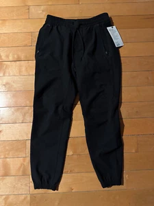LULULEMON JOGGER NEGRO LICENCIA PARA ENTRENAR HOMBRES PANTALONES BOLSILLOS CON CREMALLERA TALLA M-XXL - Imagen 1 de 6