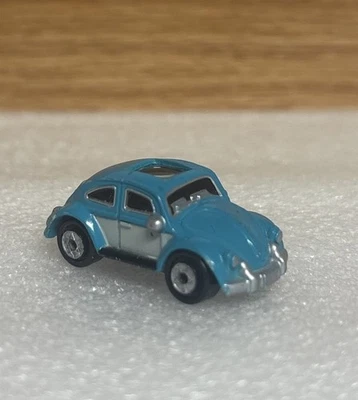 Mini coche de juguete Volkswagen Beetle 1990 vintage Galoob Micro máquinas ojos privados Foto 1 de 4