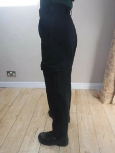 PANTALONES DE SEGURIDAD UNISEX POLICÍA NEGROS COMBATE DE CARGA TELA REPELENTE LÍQUIDO - Imagen 1 de 4
