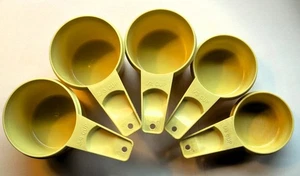 TUPPERWARE  NESTING MEASURING CUP SET in LIGHT YELLOW - Picture 1 of 5