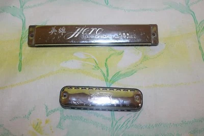 Hero Harmonica and First Act Harmonica - Image 1 of 2
