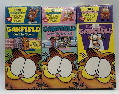 Garfield VHS Lot Of 3 Figurines Hollywood Town Here Comes Garfield HTF New 1990 — 第 1/4 张图片