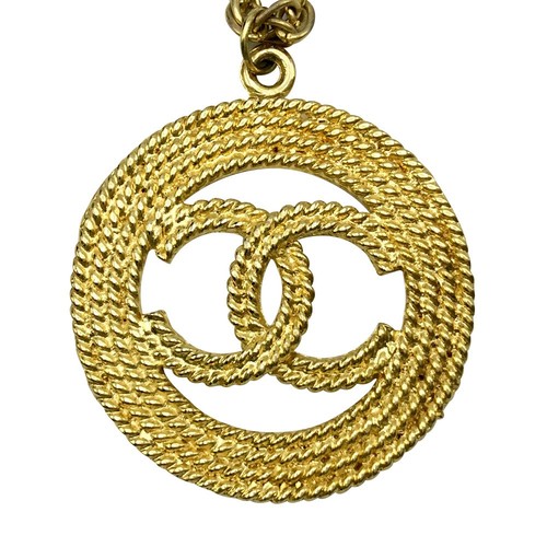 Collana lunga CHANEL oro marchio cocco logo incisione catena accessori ciondolo tondo
