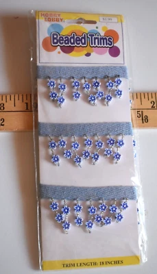 FLOWER BEADED TRIM ON BLUE TWILL  18" LONG  X   1 1/4  INCHES WIDE   NEW PACKAGE - Image 1 of 2