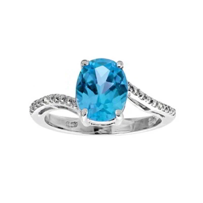 Anillo de compromiso simulado topacio azul y diamante natural enchapado en oro blanco de 14K Foto 1 de 2