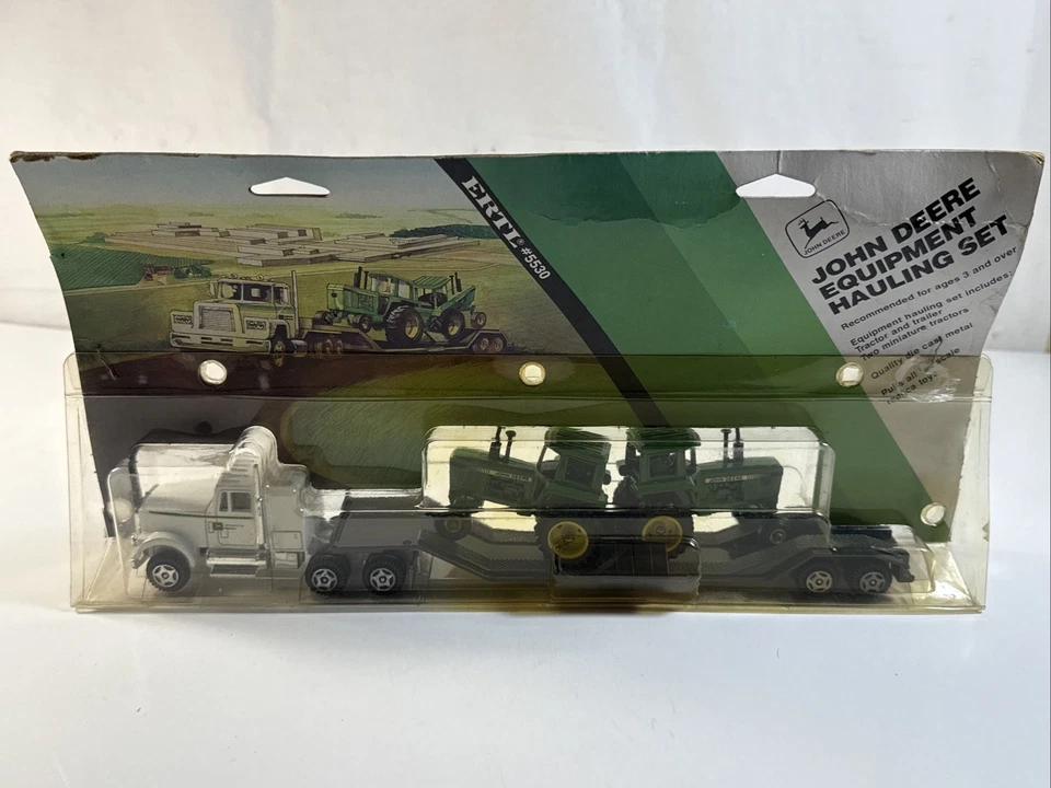 1/64 JOHN DEERE 4450 EQUIPMENT HAULING SET NIB Mack truck/1984 vintage - Image 1 of 4