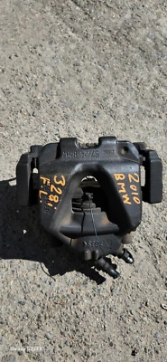 2010 BMW 328i Front left Side Brake Caliper OEM - Image 1 of 4