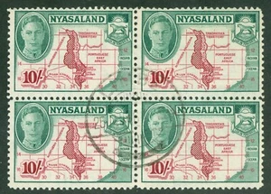 SG 156 Nyasaland 1945. 10/- claret & emerald. Very fine used block of 4 - Picture 1 of 1