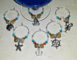 NAUTICAL Wine Glass Charms Set of 6 NEW ANCHOR SHIP WHEEL STARFISH SAND DOLLAR - Picture 1 of 7