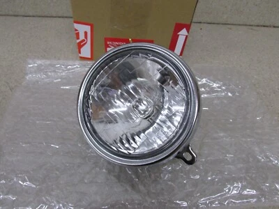 Farol NOS 72-78 HONDA Z50A K2-K6 MINI TRAIL 50 FABRICANTE DE EQUIPAMENTO ORIGINAL 6V 15/15W 33100-051-690 - Imagem 1 de 3