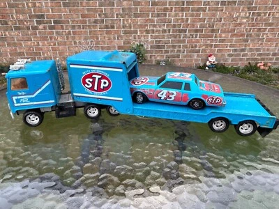 Vintage Ertl Richard Petty #43 STP Car Hauler Pressed Steel Truck w/ Car - Image 1 of 4