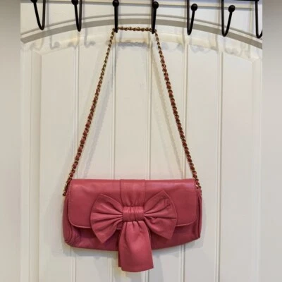 Paradox Pink Leather Bow Shoulder Purse. 10” by 6” by 0.5” with strap drop 13” - Image 1 of 4