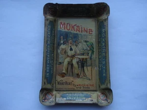 C1900-10 VINTAGE MOKAINE THE BEST OF ALL LIQUEURS "WHAT HEAT" ADV TIN ASHTRAY - Picture 1 of 1