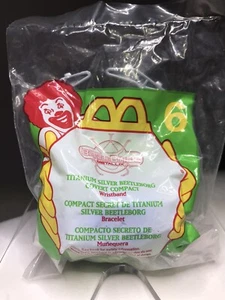 Vintage McDonald’s 1996 Happy Meal Spielzeug ~ Beetleborg Metallix verdecktes Armband - Bild 1 von 3