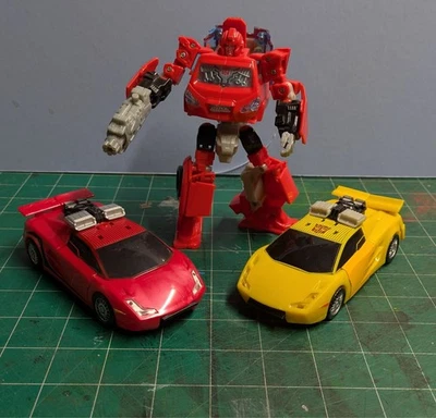 Transformers Universe Deluxe IRONHIDE 08, SUNSTREAKER 07, SIDEWIPE 09 COMPLETO Foto 1 de 4