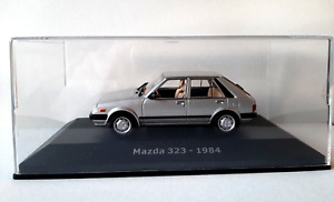 Die Cast Mazda 323 - 1984 (Inoubliable) Échelle 1  43 #ABADD152A
