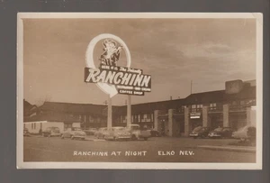 Elko NEVADA RPPC 1950 RANCHINN MOTEL Restaurant CASINO Neon Lights GAMBLING NITE - Picture 1 of 2