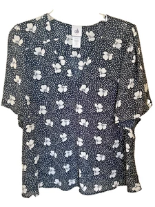 Top esencial estampado Cabi Spring 24 azul marino blanco punto floral #6506 grande - Imagen 1 de 4
