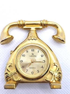 Reloj de escritorio en forma de teléfono pequeño, color dorado adecuado para decoración de oficina Foto 1 de 4