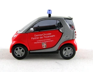 Busch 489308 Smart City Coupe Pompiere Mecklenburg Vorpommern HO 1:87 NUOVO - Foto 1 di 1