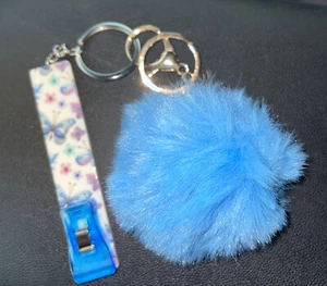 Llavero Grabber para tarjeta de crédito ATM/GAS con pompón y pinza - ENVÍO GRATUITO - Imagen 1 de 1