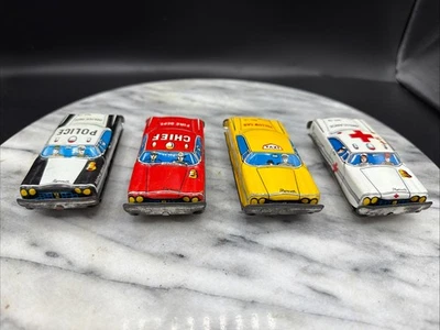 Japan Lot of 4 Cars  Tin Litho Friction.  Police, Fire Chief, Taxi, Ambulance - Image 1 of 4