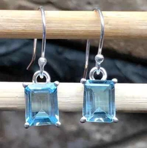 3Ct Emerald Cut Simulated Blue Topaz Drop/Dangle Earrings 14K White Gold Plated - Picture 1 of 2