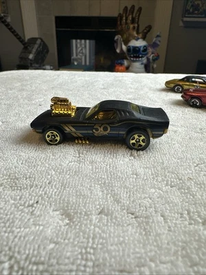 2018 HOT WHEELS 50TH BLACK AND GOLD RODGER DODGER 1:64 DIECAST 2 7/8" CAR - Image 1 of 4