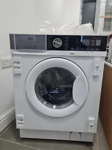 New Unboxed AEG 7000 Series L7WE7631BI Integrated 7 kg Washer Dryer - Picture 1 of 6