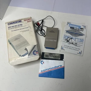 Módem Commodore 1660 300 C64 vintage con manual, caja y cable sin probar - Imagen 1 de 11