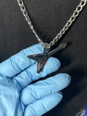 Colgante de guitarra de acero inoxidable Foto 1 de 3