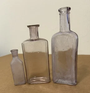 Antique bottle lot of 3 lavender shades tint 4" - 7 1/4" glass one is Winsteads - Picture 1 of 16
