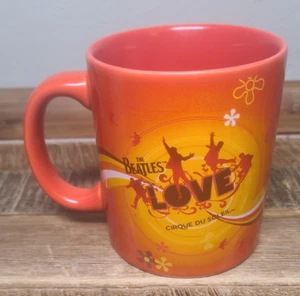 Taza de café de cerámica Cirque du Soleil’s “The Beatles LOVE” naranja y rojo 12 oz - Imagen 1 de 7