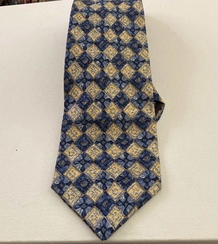 Corbata geométrica de seda Geoffrey Beene azul marino y dorada para hombre Foto 1 de 4