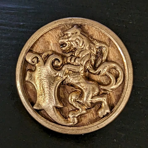 Antique Stamped Brass Lion w/ Shield Button w/ Wood Background 7/8in - L003 Cover