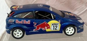 BURAGO 1/18 DIECAST FORD FOCUS RED BULL RALLYE CAR IN BLUE DAMAGED REAR GLASS - Picture 1 of 6