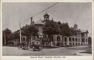 Garrett,IN Sacred Heart Hospital,Old Cars DeKalb County Indiana Postcard - Picture 1 of 2