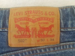 Pantalones de mezclilla Levi Strauss & Co para hombre azules de ingeniería rojos etiquetados 502 con cremallera W32 x L30 - Imagen 1 de 12