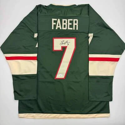 Autographed/Signed Brock Faber Minnesota Green Hockey Jersey JSA COA - Image 1 of 4