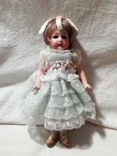 ANTIQUE DOLL with lace dress and short hair