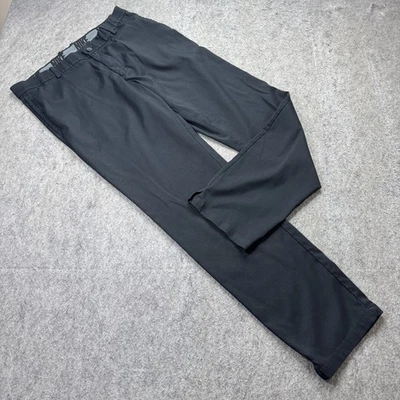Pantalones de golf Nike para hombre 34 x 32 negros delanteros planos elásticos Flex Core estándar AJ5489 b Foto 1 de 4