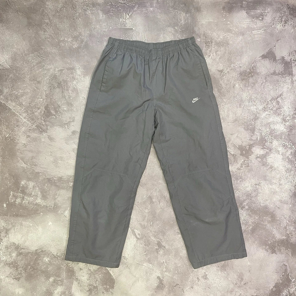 Pantalones deportivos holgados Nike vintage años 90 talla M gris cremalleras nailon Y2K bombo Foto 1 de 4