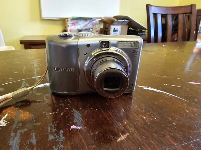 Canon PowerShot A1100 IS 12.1MP Digital Camera Silver W/ CD And Insert - Image 1 of 4